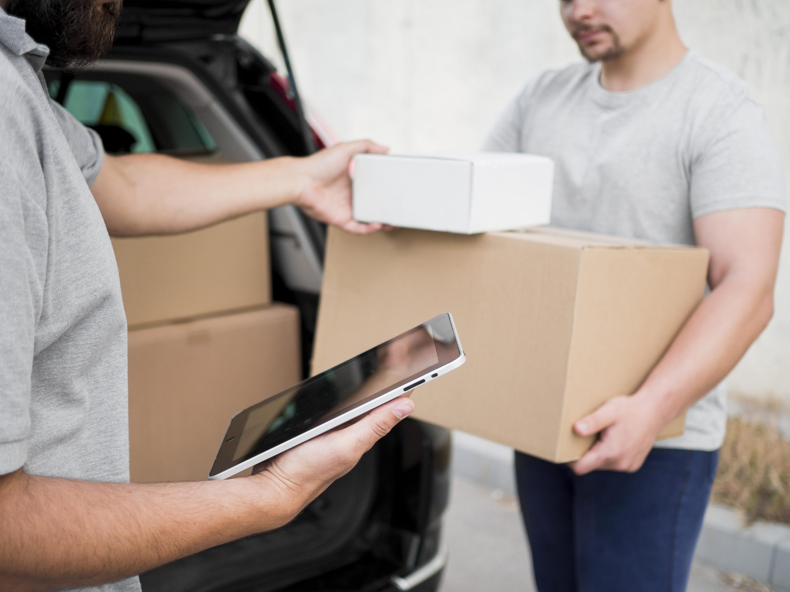 close-up-delivery-man-with-boxes