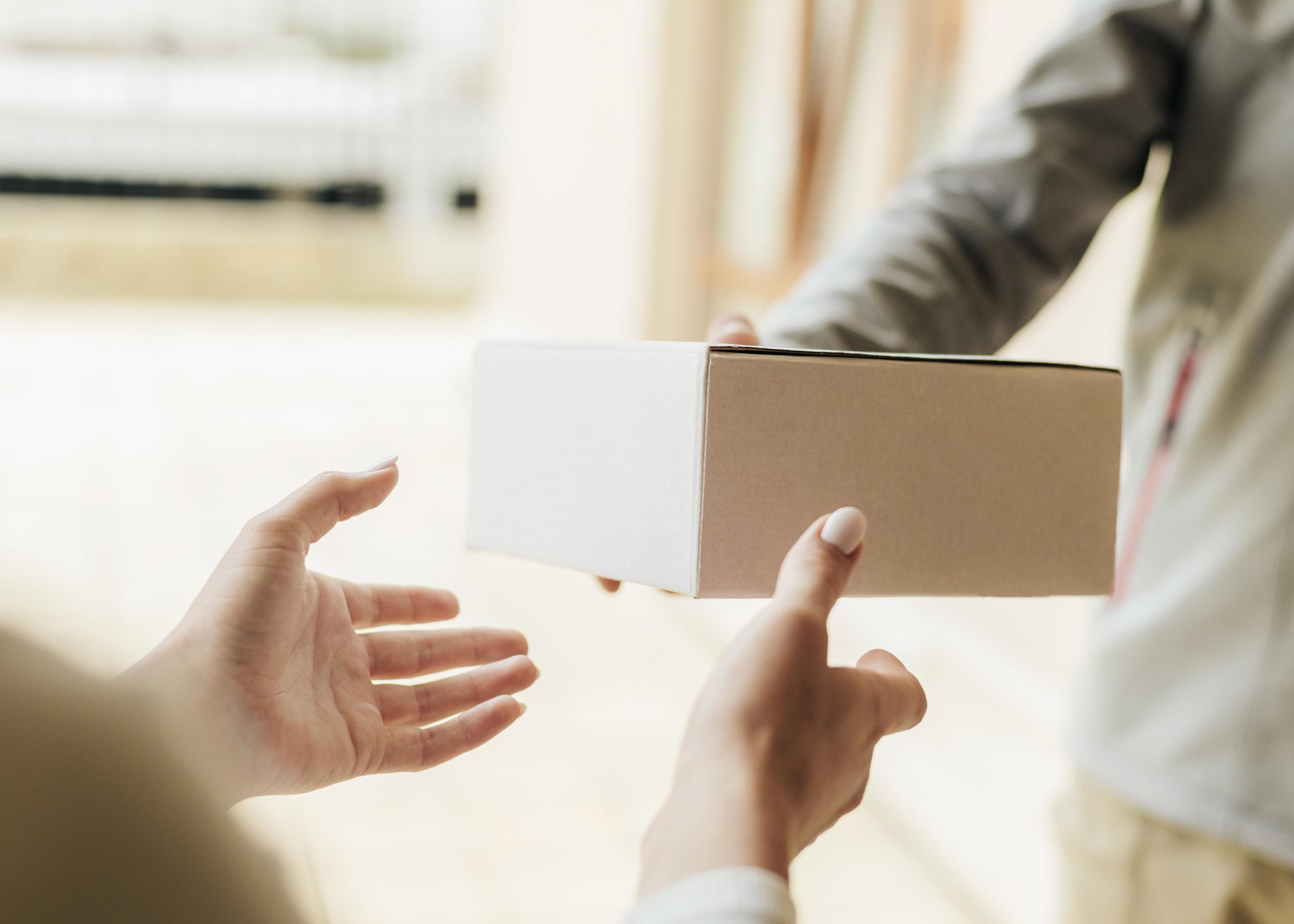 close-up-hands-getting-box